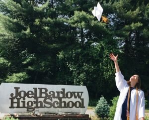 2018 Joel Barlow graduate Mackenzie Wenzel tosses her cap into the air.